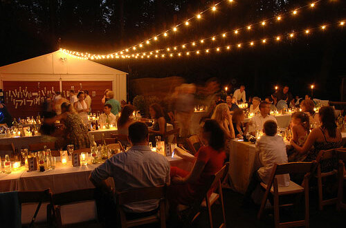 string lights, people and shed