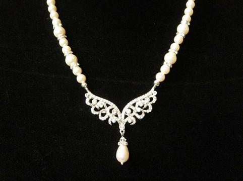 lace, pearls and lace and wing