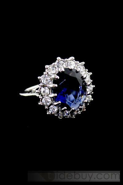 beautiful ring, big blue gem and wedding theme