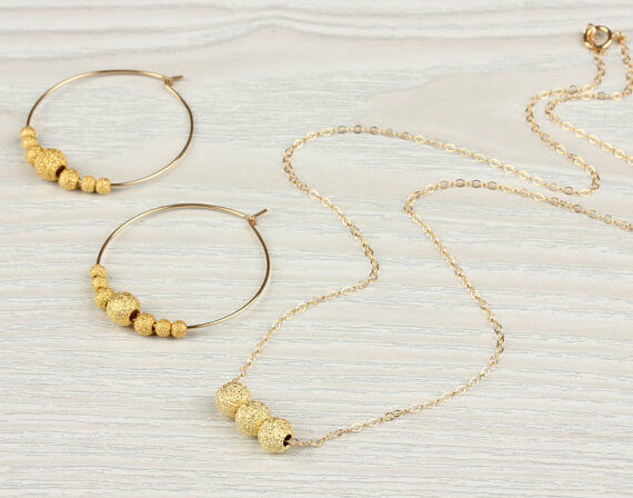 iris, gold beads necklace and geometric necklace
