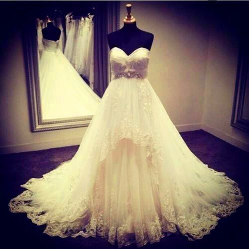 white, sleeveless, lace up and wedding dress