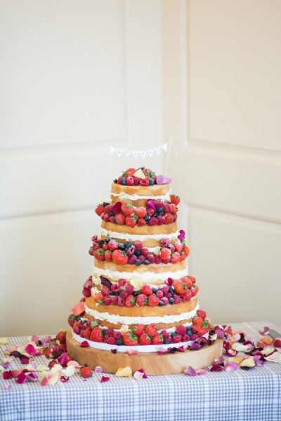 cake, berries and rose petals