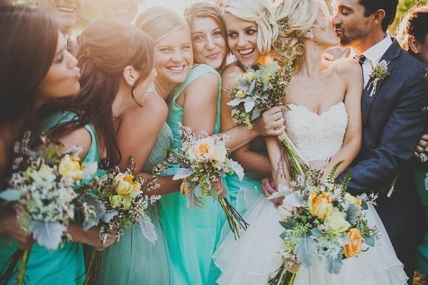groom, lights and bridesmaids
