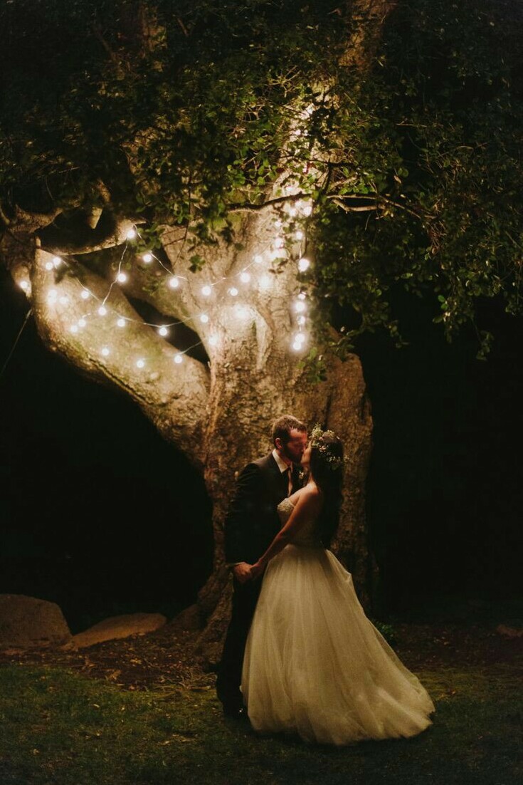 nightwedding, outside, lightsaroundtree and weddingdress