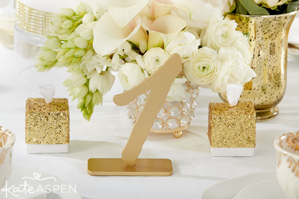 gold glitter favor boxes, wedding favors and gold table numbers