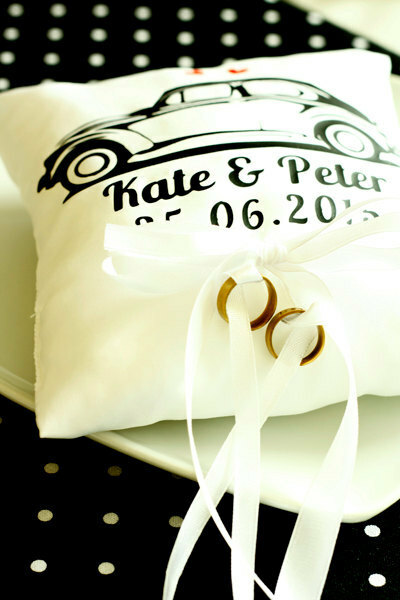 white, beetle car and wedding rings pillow