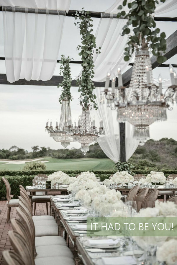 reception, chandeliers, glam and white flowers