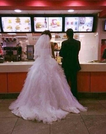 couple, fast food and wedding dress