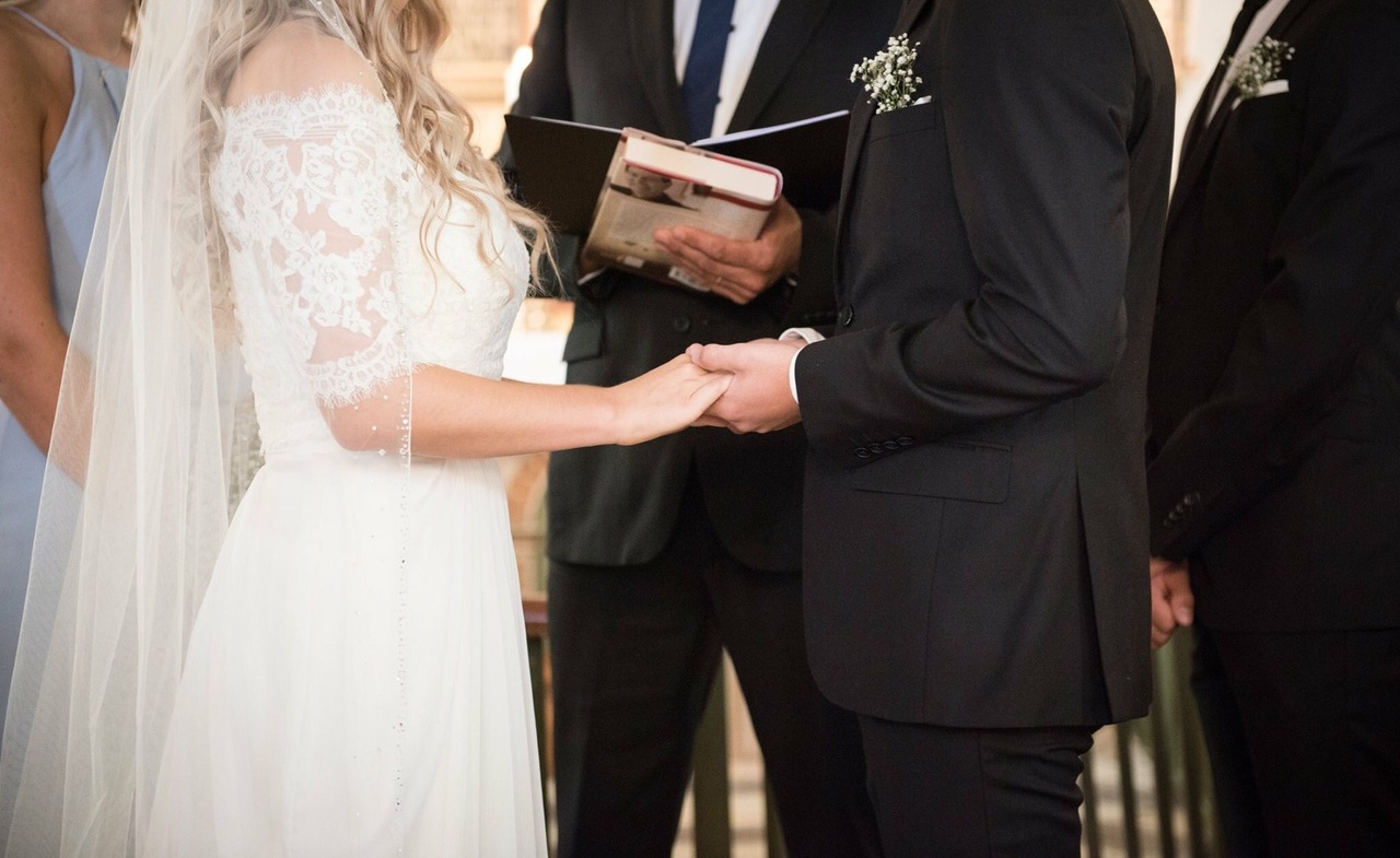man, holding hands, woman and weddingdress