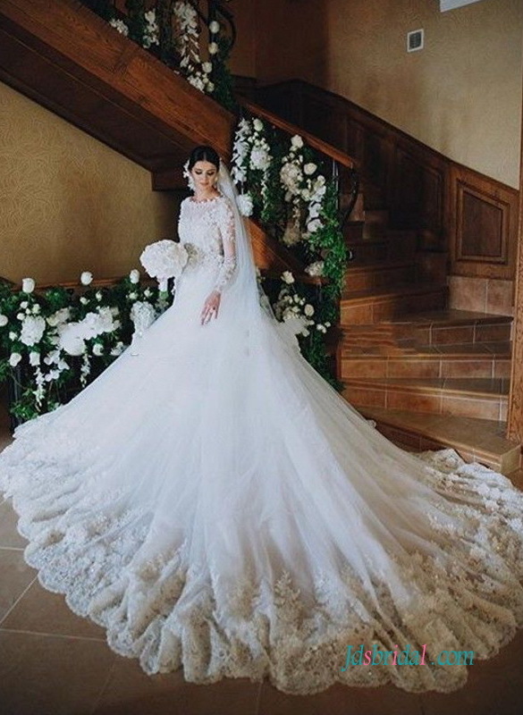 with long sleeves, illusion bateau neckline, illusion bodice and 3d flowers detailed