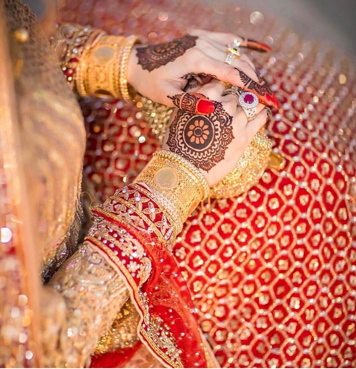 henna, hands and gold jewellery