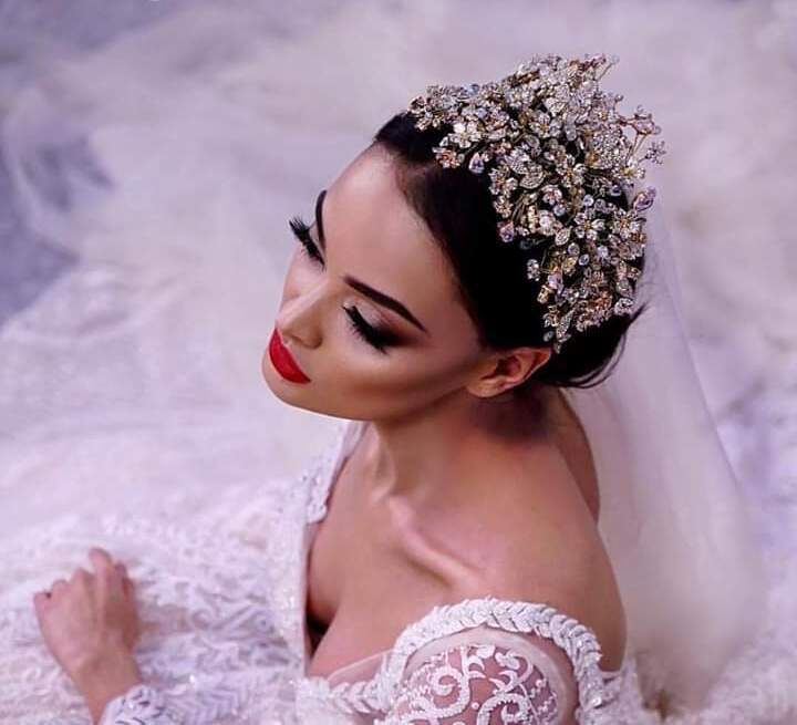 Queen, crown, jewellery and wedding dress