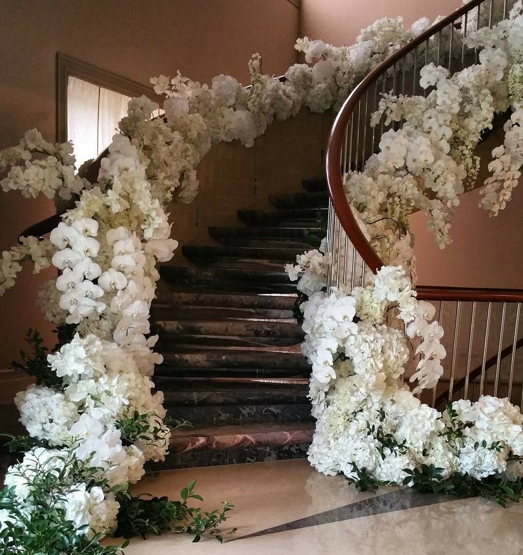 wedding vibe, staircase, flowers and luxe