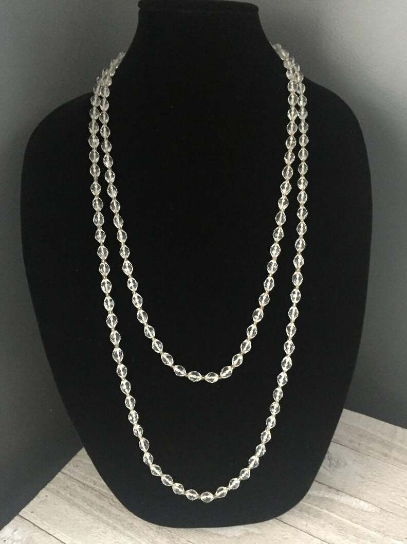 flapper, bead necklace, oval beads and faceted crystal