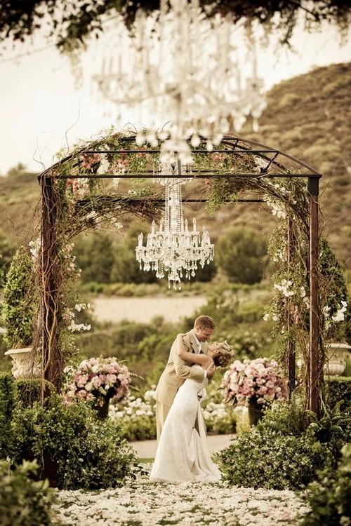 groom, husband, garden and chandeliers