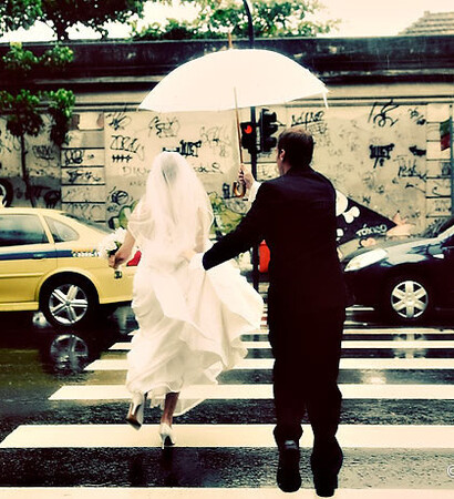 rain, bride and groom and street