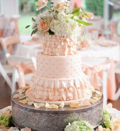 white cake and flowers, reception and ruffles