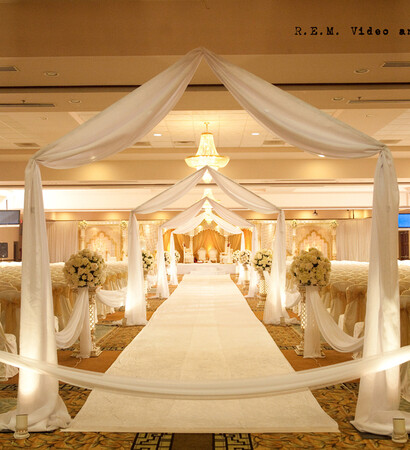 fabric archways, floral arrangements and wedding decor