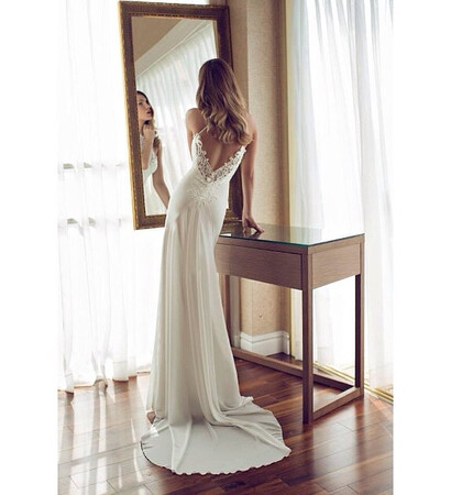 white, curls and bare back