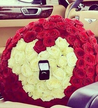 ring, white roses and red roses