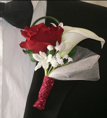 boutonniere, tuxedo and baby's breath