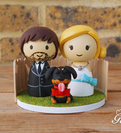 bride, wedding cake topper and groom