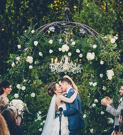 flowers, groom and chandelier
