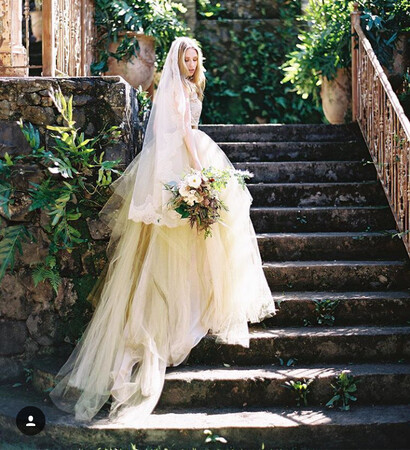 boquet, stairs and wedding gown