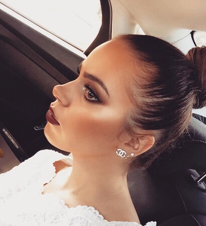 up do, eyebrows and lipstick